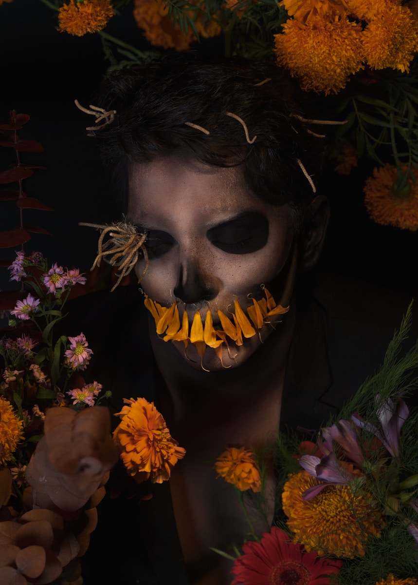 Photo by Mike Mike Collections A man with a skeleton face and flowers around him